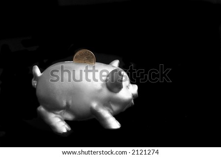 Silver piggy bank over black background with one dollar