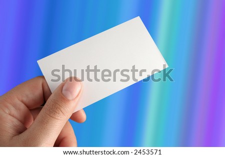 hand holding a presentation card over a gradient back ground clippinng path included