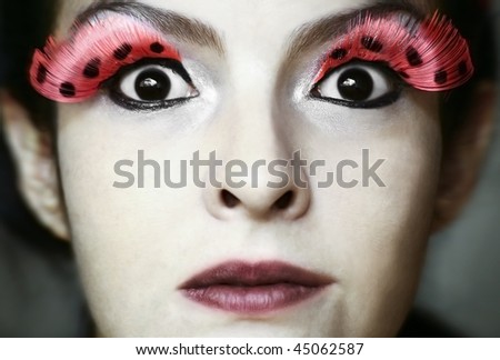 Surprise face with fake eyelashes