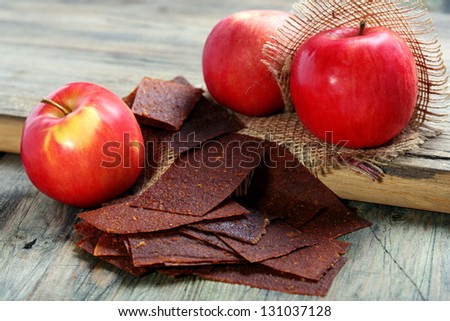 Apple fruit and paste on a wooden table.