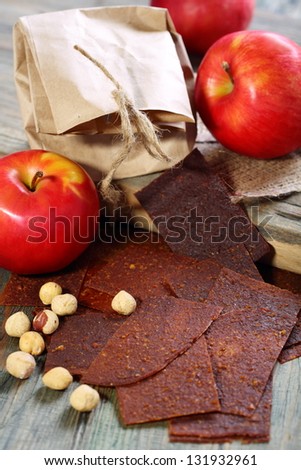 Apple fruit and paste on a wooden table.