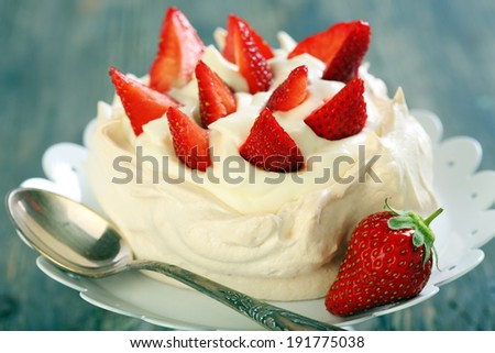 Dessert with lemon cream and strawberries closeup.