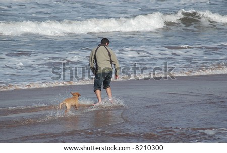 man playing with his dog