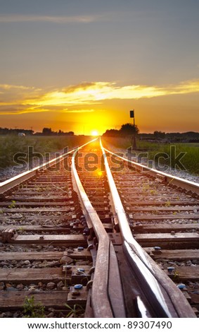railway track leading to the sunset