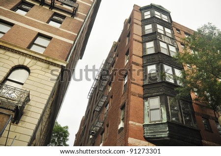 couple of tall old apartment building