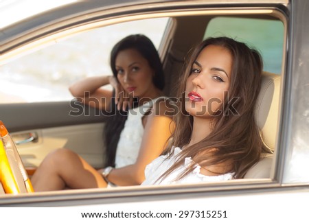 young women in the car  waiting