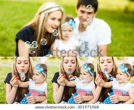 Man woman and child blowing soap bubbles in the park on the grass