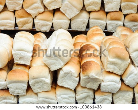 Lot of bread on the shelves of small shop in the zoo.
