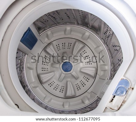 White drum or modern washing machine.