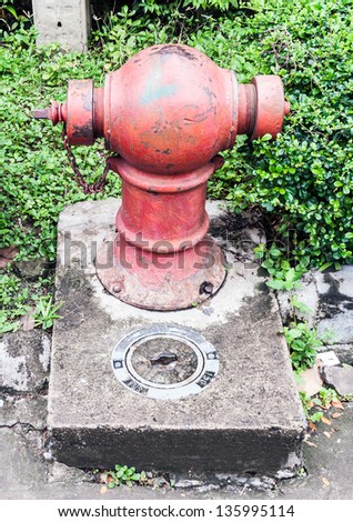 Old fire hydrant on the street of urban town.
