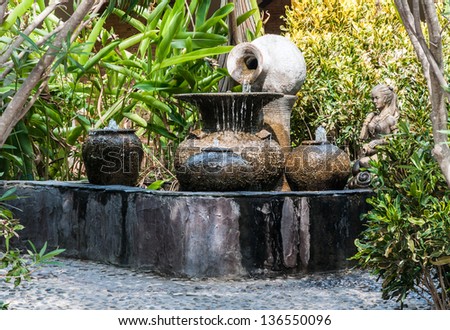 Clay pots fountain in Thai style of the natural resort.