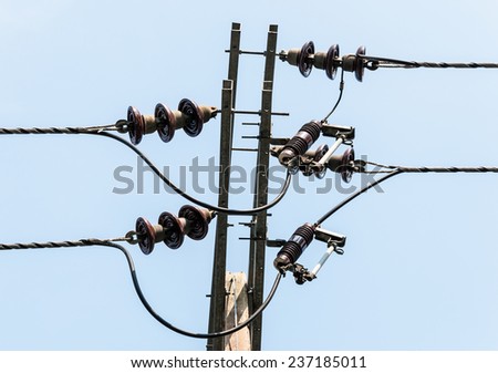 Electrical insulator on the top of electrical pole.