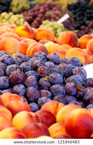 Heap Of Fresh Organic Peaches And Damson Plums At A Turkish Street Market