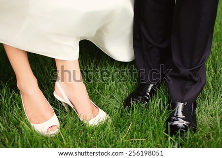 Wedding couple close-up on feet