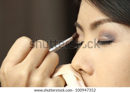 Portrait of beautiful woman, making up on her wedding ceremony. Shallow DOF