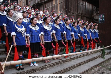 GUANGXI - SEPTEMBER 17: Dong ethnic minority people with traditional dress sing a song called 