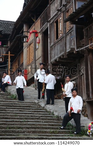 GUANGXI - SEPTEMBER 17: Dong ethnic minority people with traditional dress sing a song called \