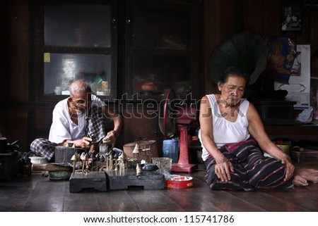 CHIANG MAI - OCTOBER 8: Unidentified man works with traditional method of making ancient hairpin for souvenir on October 8, 2012 in Chiang Mai, Thailand.