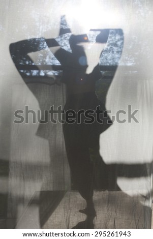 sunbath yoga with beautiful light and shadow in the morning, taken through white curtain