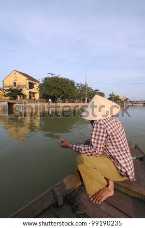 Vietnamese Ferryman in Hoi An, Vietnam. tourist can pay for crossing the river and sight seeing