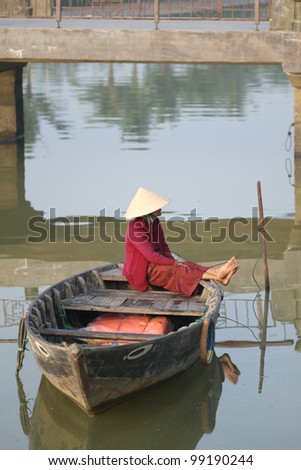 Vietnamese Ferryman in Hoi An, Vietnam. tourist can pay for crossing the river and sight seeing