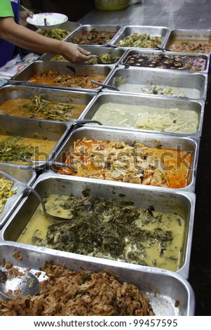 Many kine of Thai food in market. take home curries