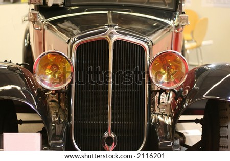 front of an antique french car