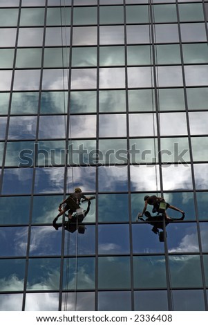 glass cleaning team on clouds background