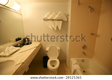 hotel bathroom, marble sink and toilets