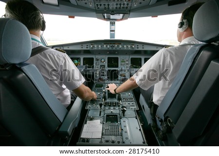 jet airplane at takeoff with two pilots
