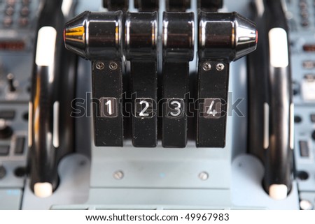 jet airplane four thrust levers in the cockpit