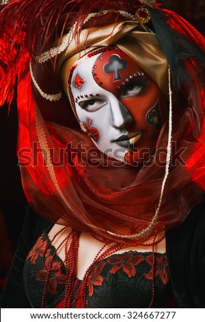 Cool Venetian mask makeup over vintage interior. Masquerade. Halloween.