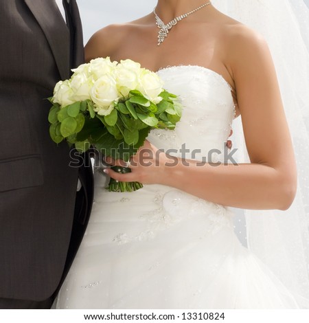 stock photo bride holding bridal bouquet with white roses