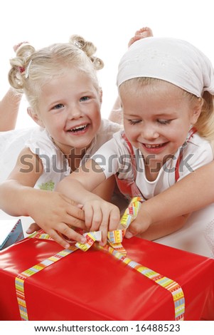 two cute girls celebrating special occasion, unpacking gifts together