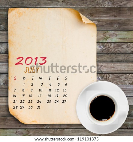 July 2013 Calendar, Vintage paper with Black coffee on wood panels background