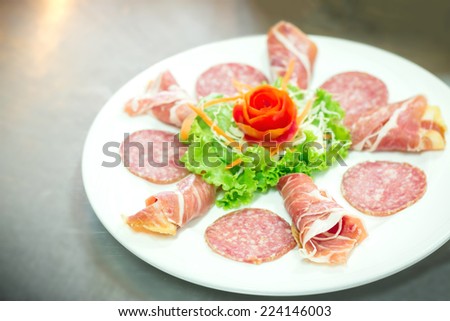 Delicious and tasty meat dishes. Parma Ham, salami. Italian appetizers.