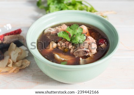 stew of pork and herbal soup, ba kut teh on wood table