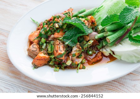 spicy Thai food minced salmon with salad