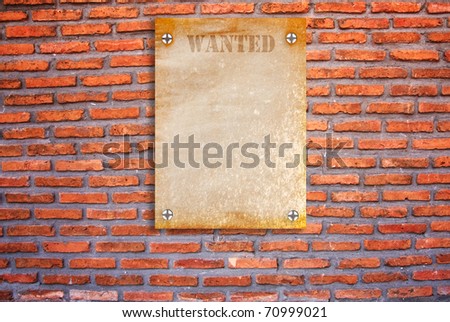 Wanted poster on grunge brick wall background