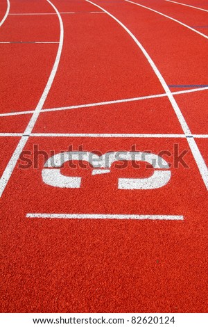 Number 3 on the start of a running track