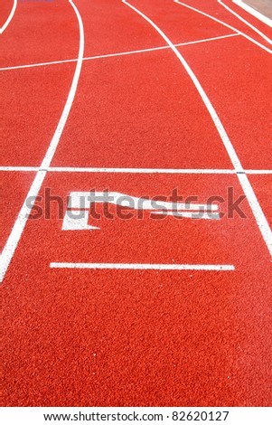 Number 7 on the start of a running track