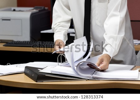 businessman search paper from file