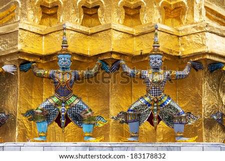 The Statues of Demon - Guardians (Giant) protected golden pagoda in The Emerald Buddha Temple (Wat Phra Kaeo) Grand Palace , Bangkok , Thailand.