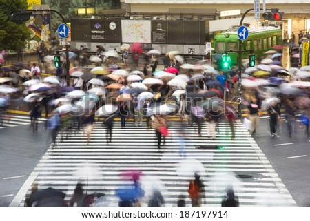 TOKYO, JAPAN - OCTOBER 25: Pedestrians cross at Shibuya Crossing on Oct 25, 2013. The intersection is known as the busiest in the world.