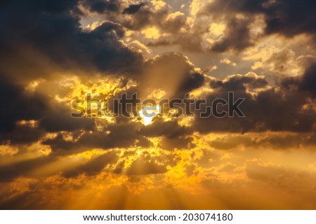 Cloud sun beam ray light warm orange color Dramatic background