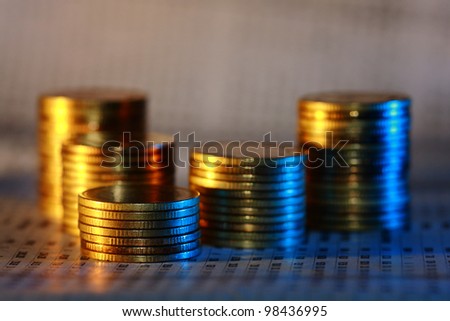 gold coin money with opposite color light, orange and blue