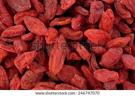 Background texture of dried Goji berries, or wolfberries.