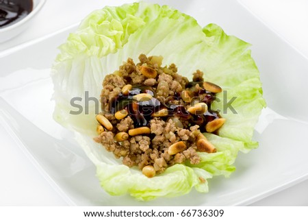 Asian lettuce wrap with ground beef, hoisin sauce and toasted pine nuts.