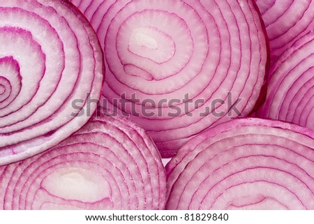 Background texture of fresh red onion slices.