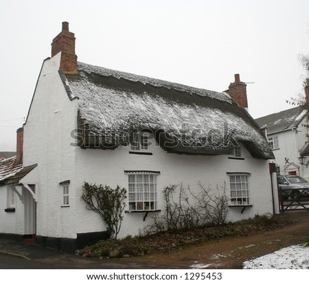 Quaint rural house dusted with snow at Christmas time.